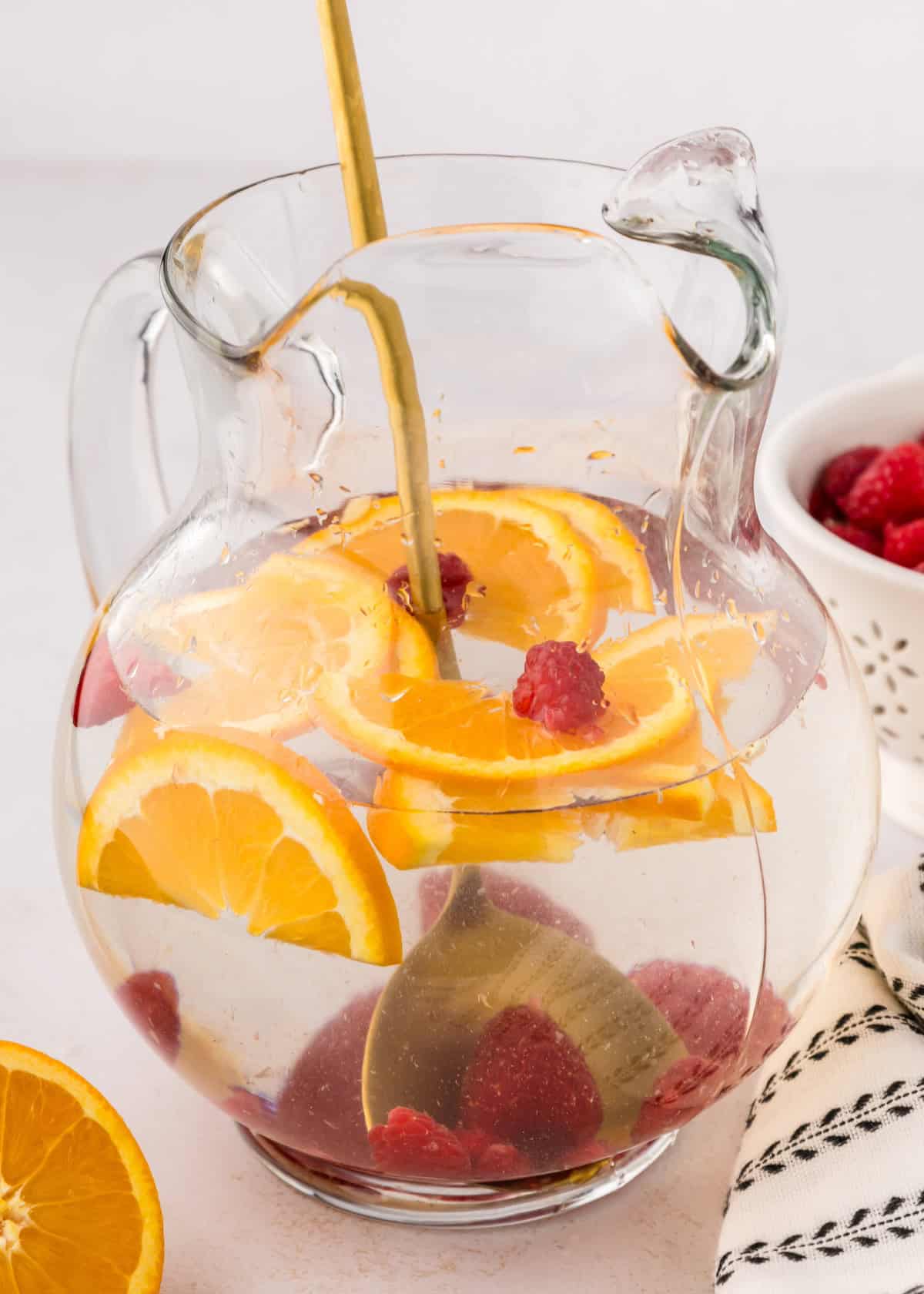 Raspberry Infused Water in a large pitcher.