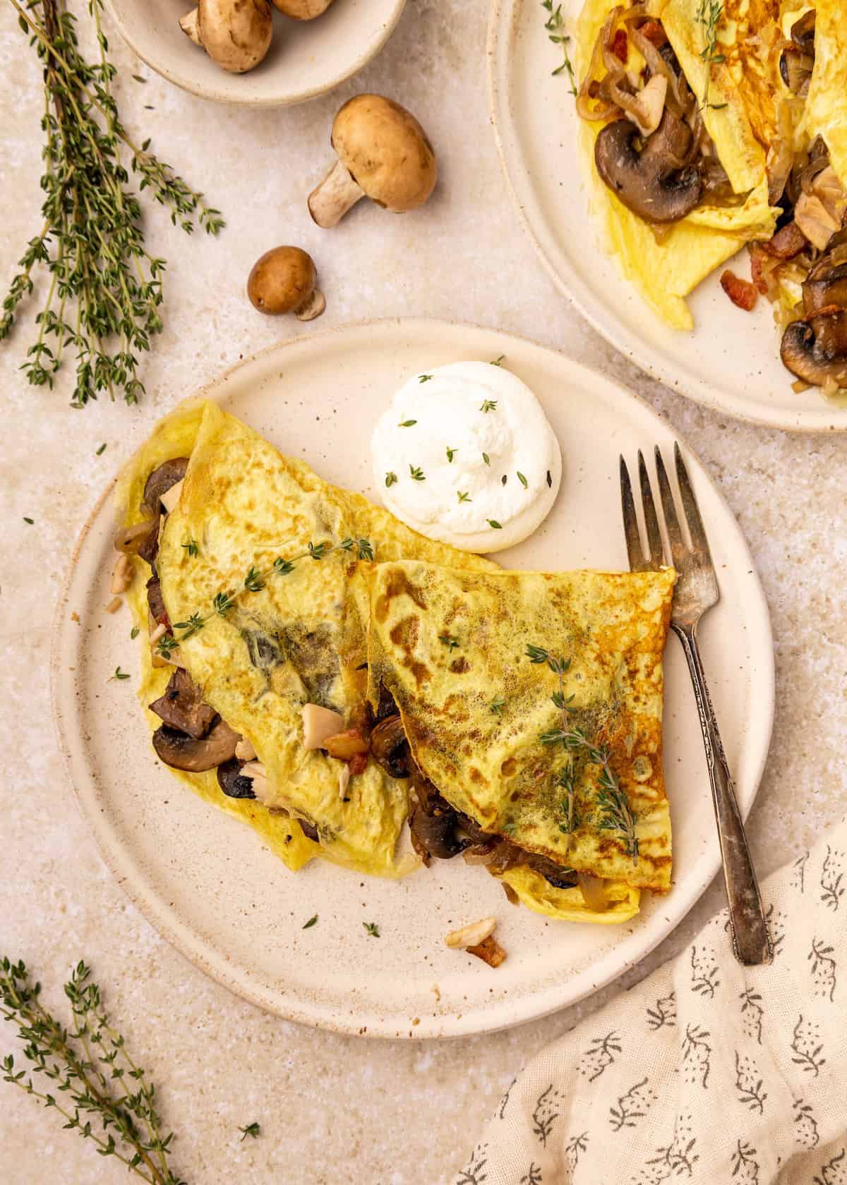 Omelette with mushrooms and herbs, served with cheese and a hint of chicken mushroom crepes.