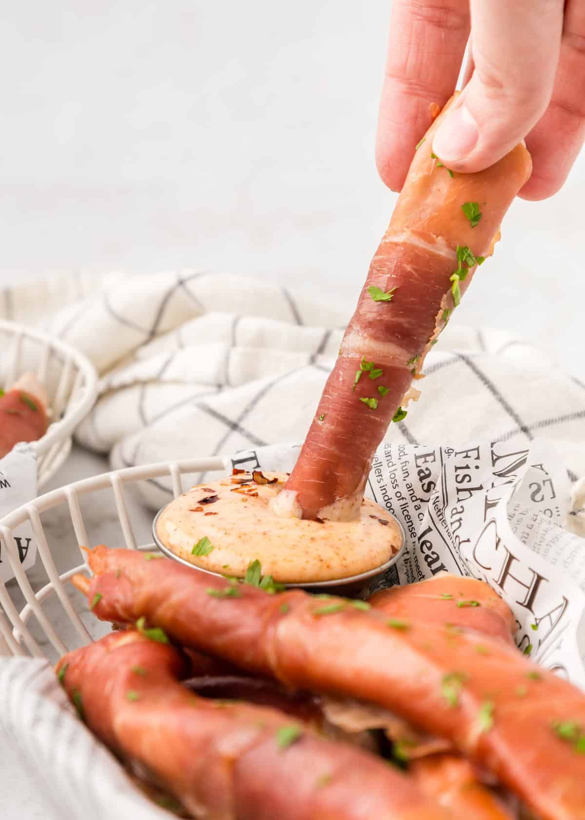 Prosciutto Wrapped Chicken dipped in chili mayo.