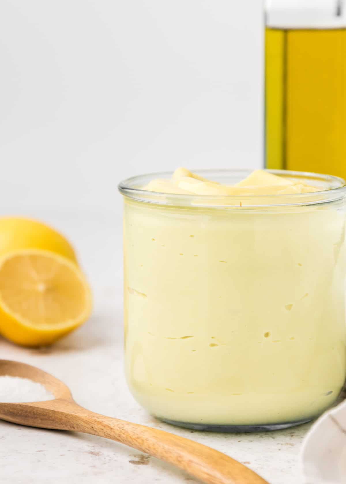 Homemade Mayonnaise in a small glass jar.