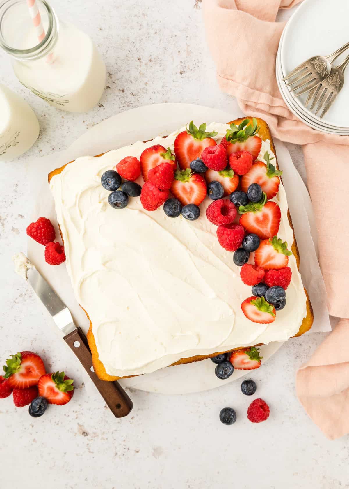 Top shot of Vanilla Sheet Cake, decorated with berries.