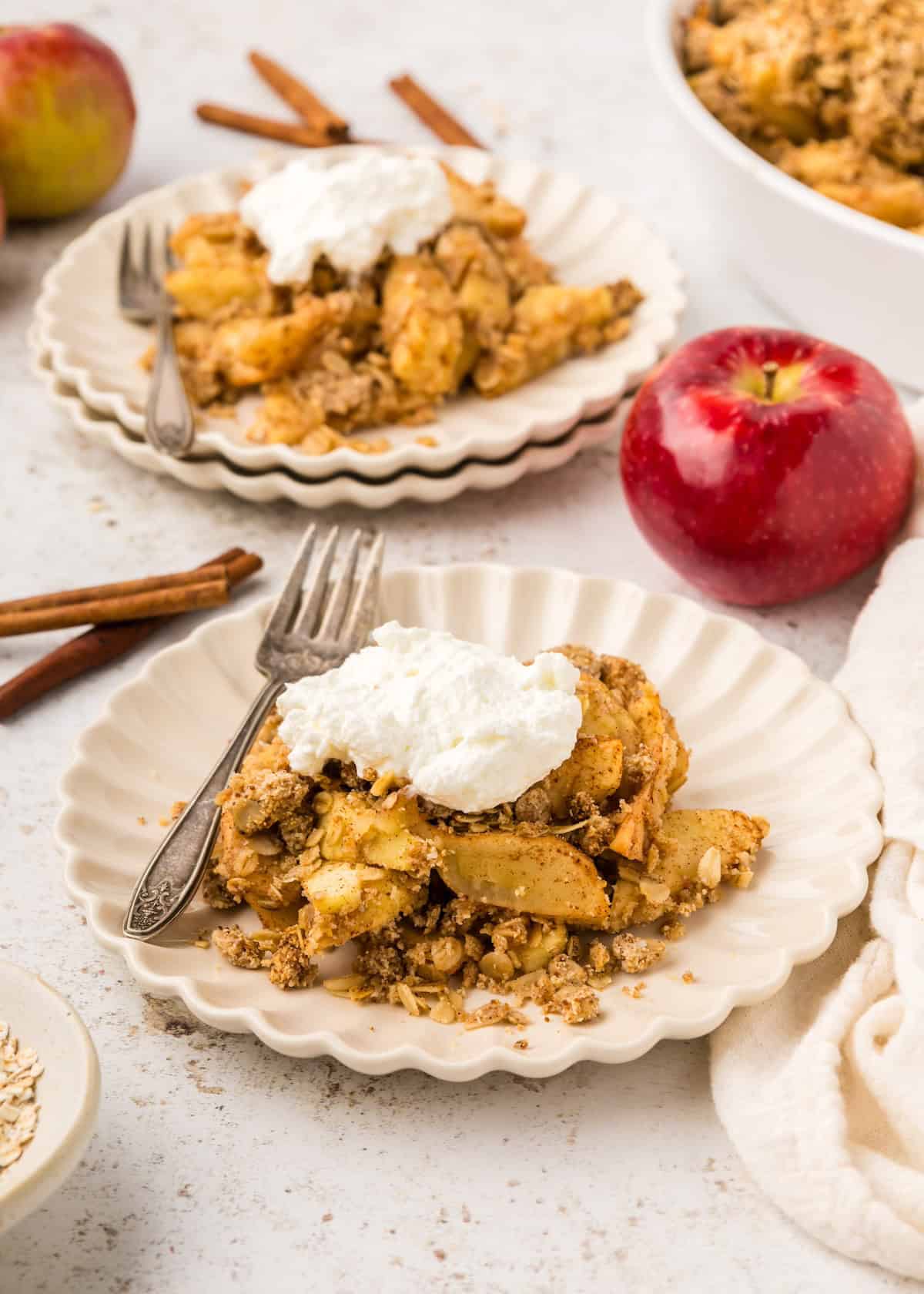 Healthy Apple Crisp served with whipped cream.