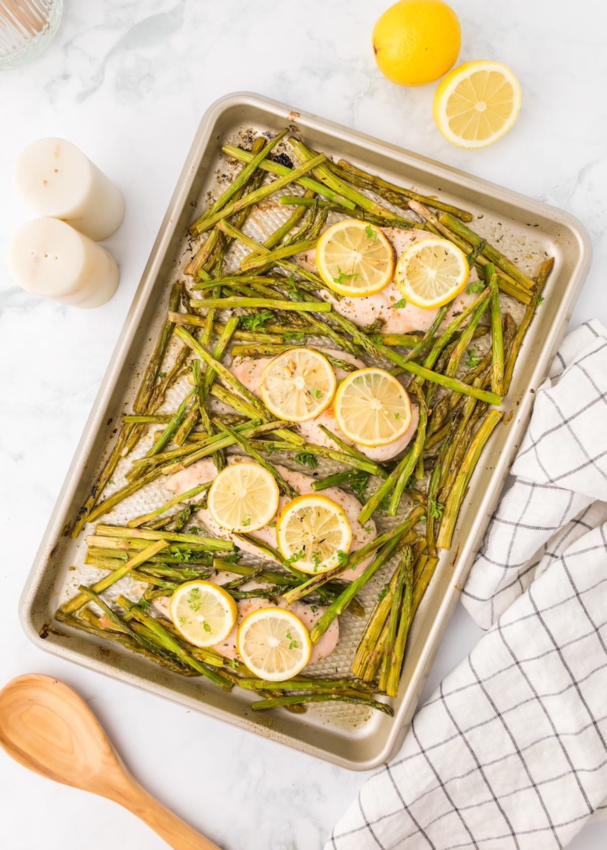 Baked salmon and asparagus on a sheet pan, inspired by classic Sheet Pan Lemon Chicken flavors.