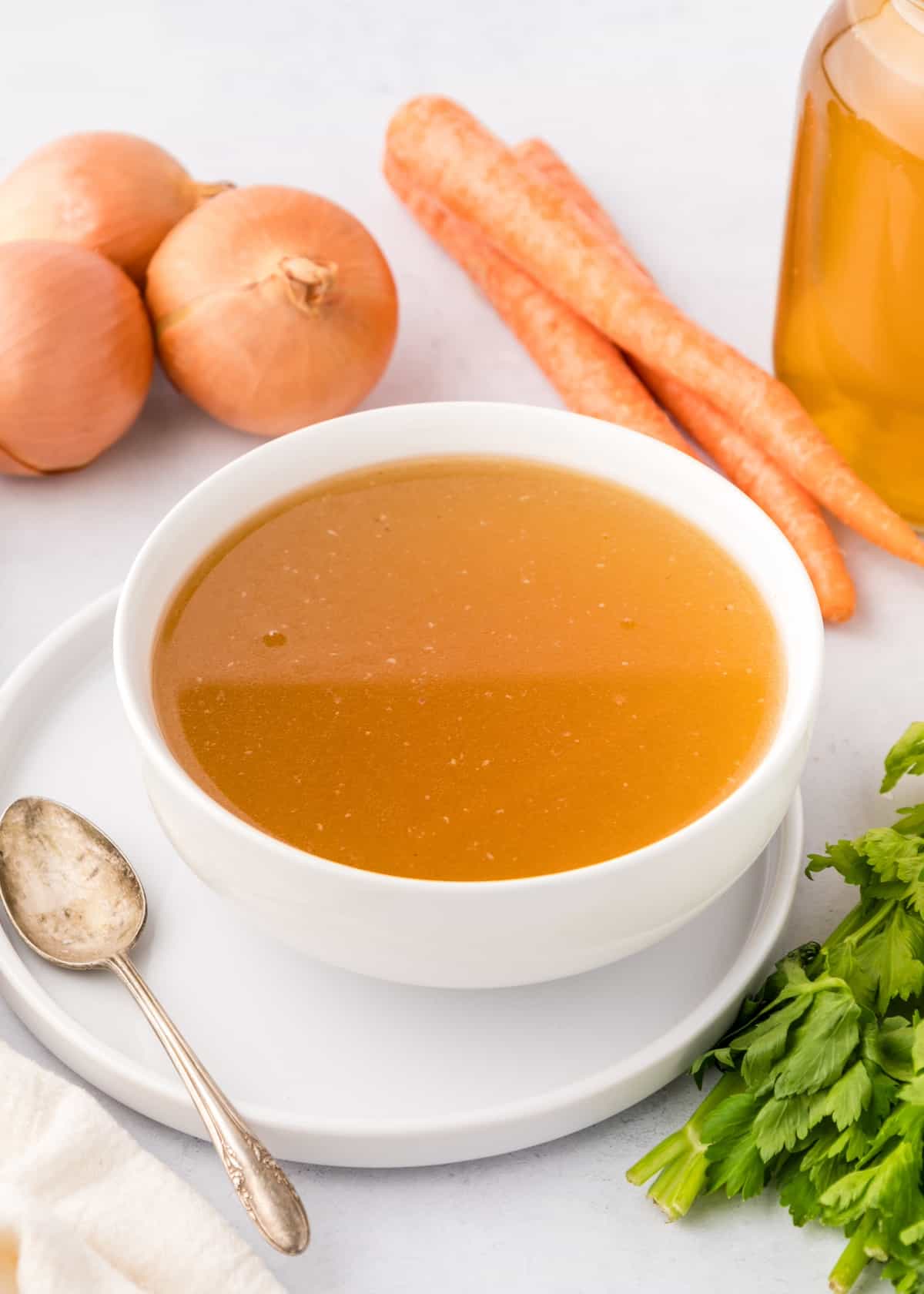 chicken bone broth in white bowl