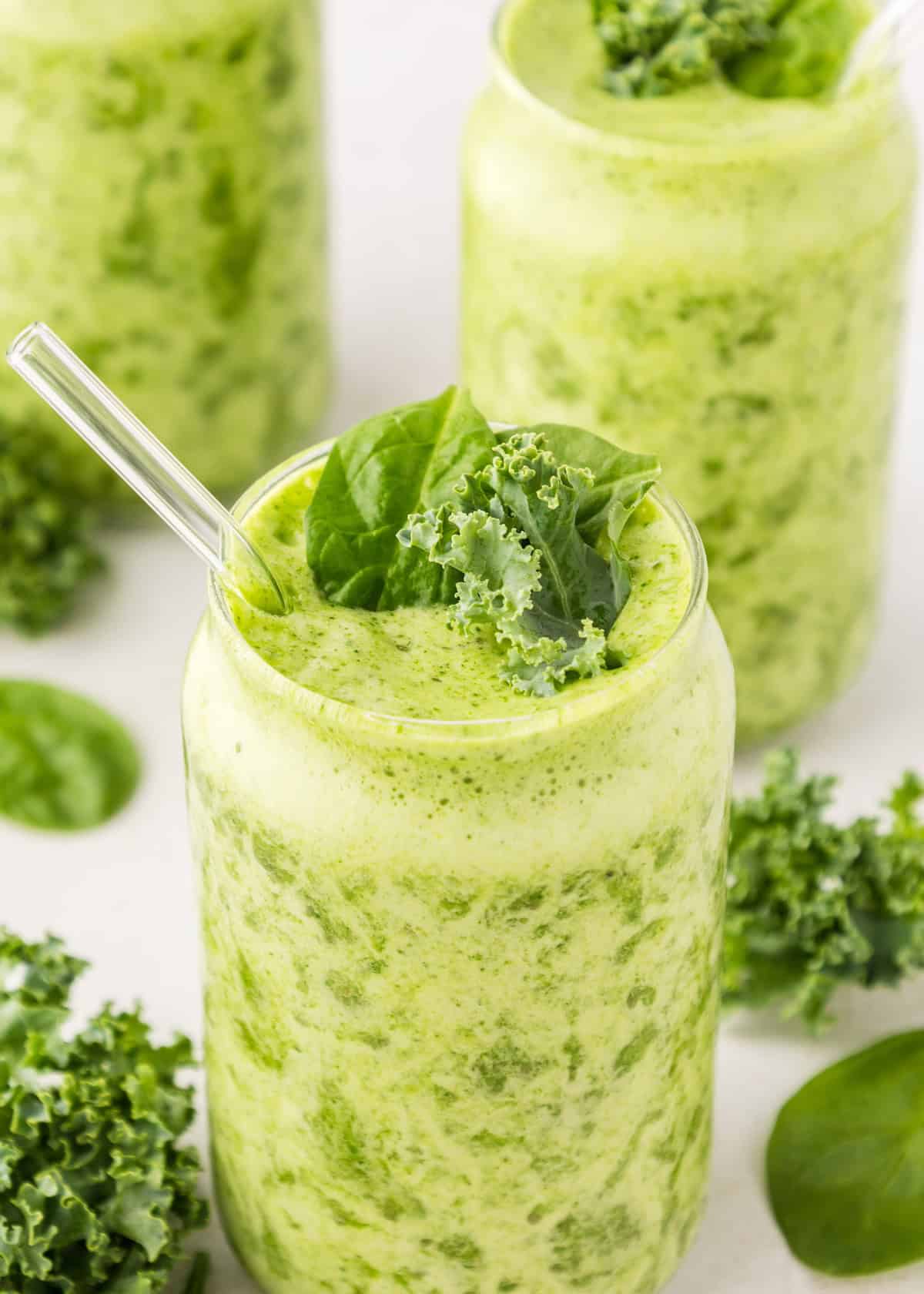 spinach smoothie served with straw
