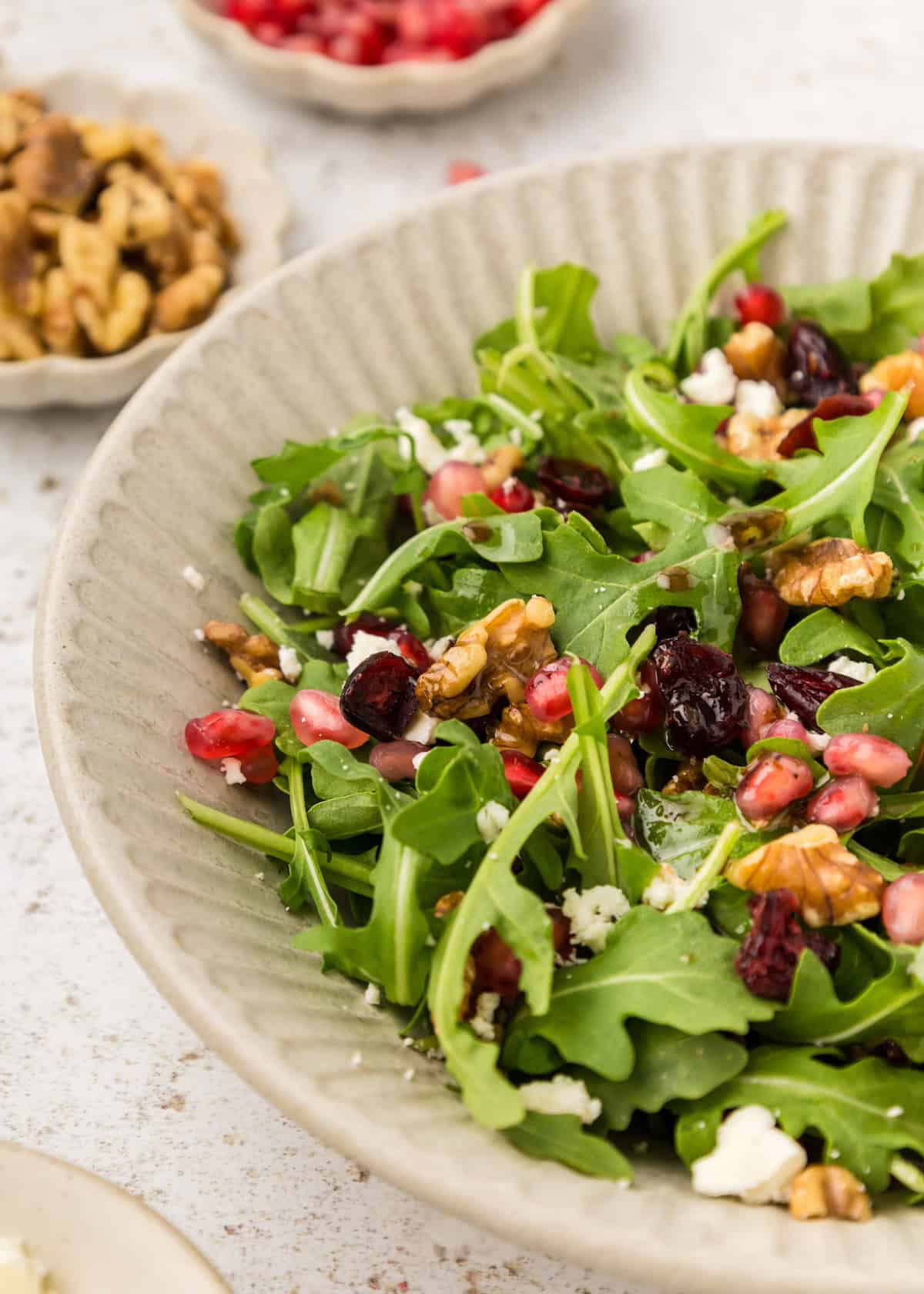 Winter Salad topped with walnuts, pomegranate arils, and feta.