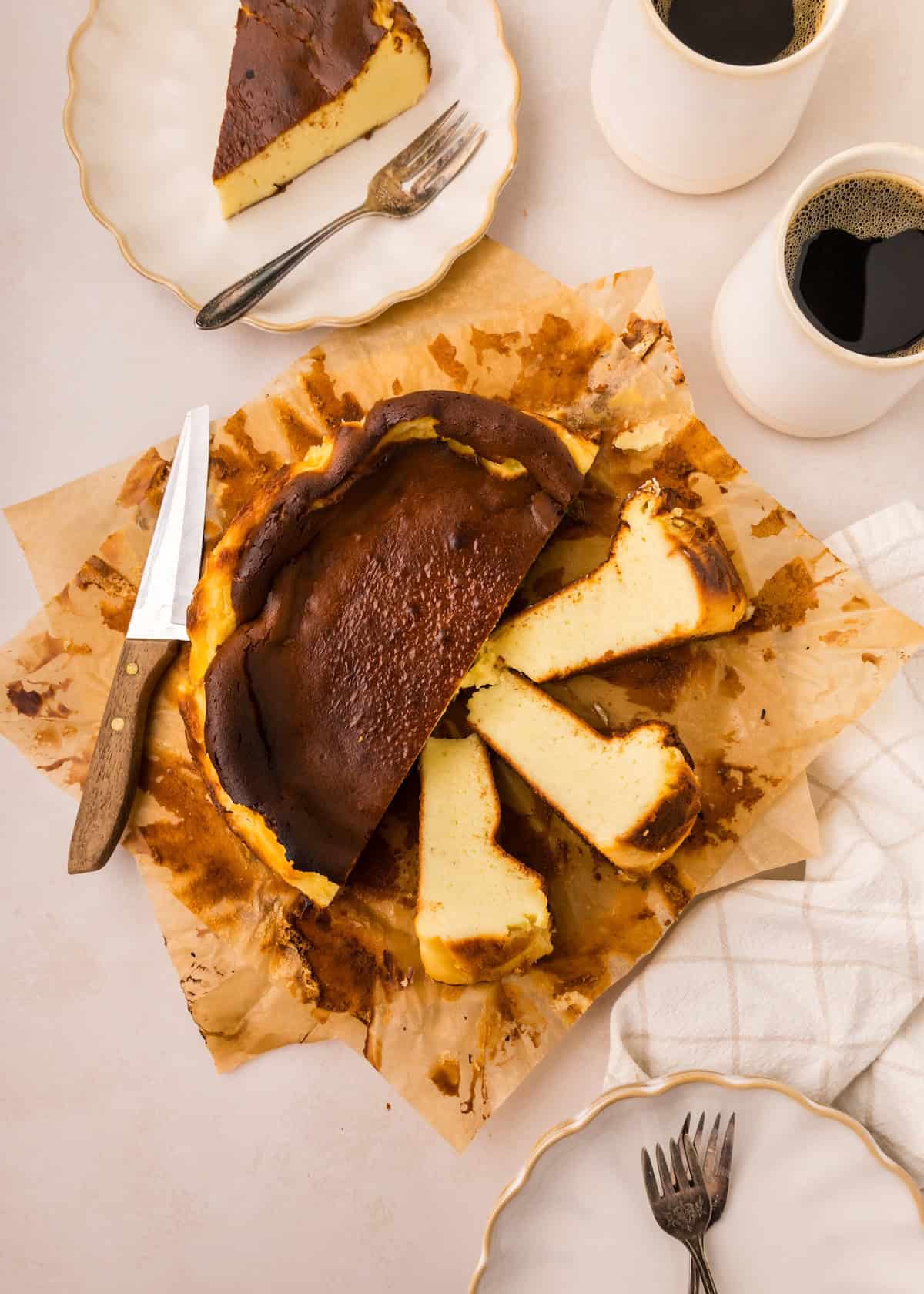 Basque Cheesecake, with slices in a swirl pattern.