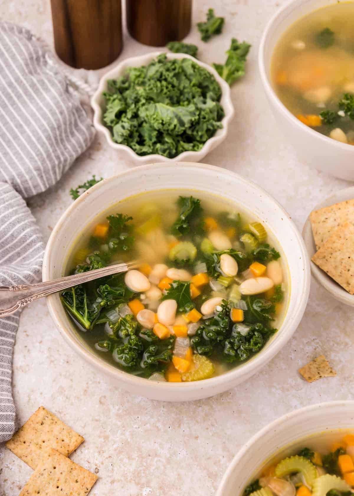 White Bean Soup served in a bowl with spoon.